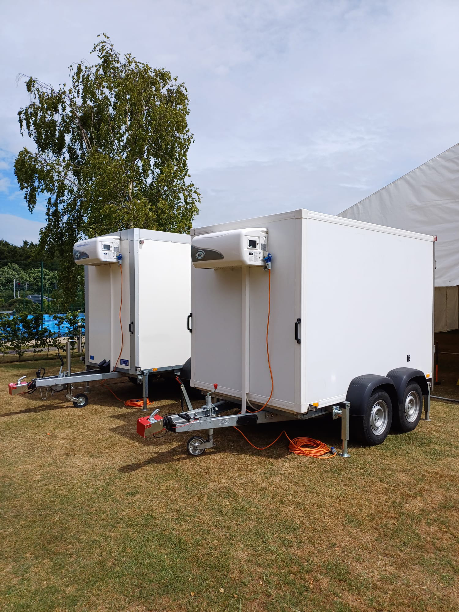 Front view of pair of trailers either a portable refrigeration hire trailor or Portable Freezer Hire trailer